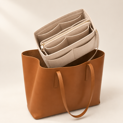 TravelPack Bag Organizer insert lifted into a brown tote bag
